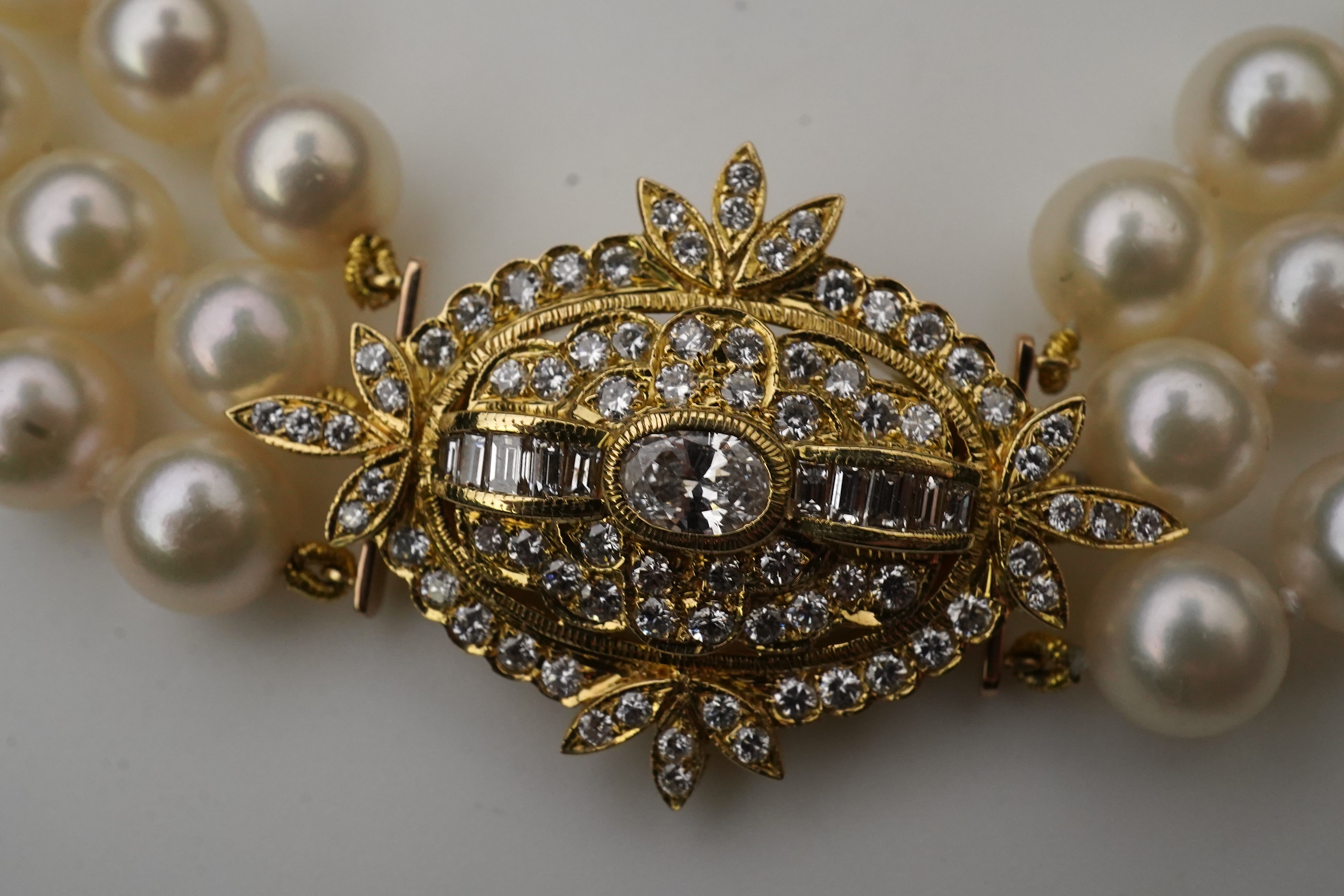A cultured pearl and diamond necklace/brooch